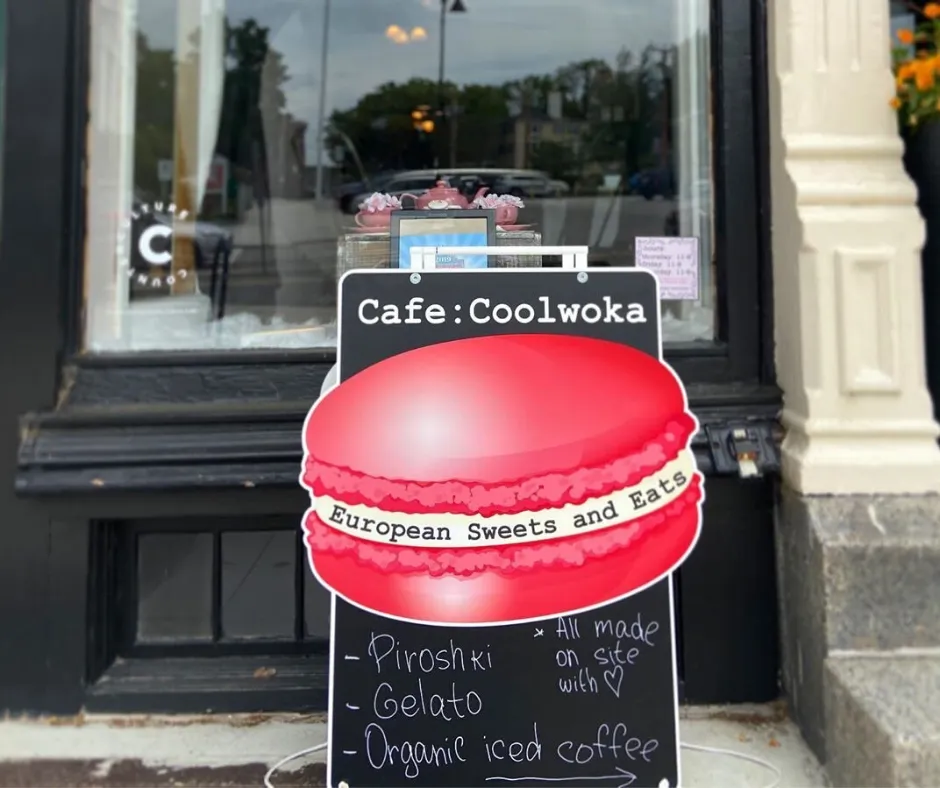 Custom shaped sandwich board on a sidewalk