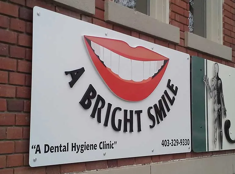 Dimensional exterior sign mounted on a brick wall