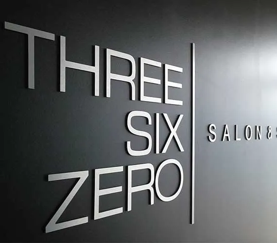 Brushed silver dimensional wall letters for a salon