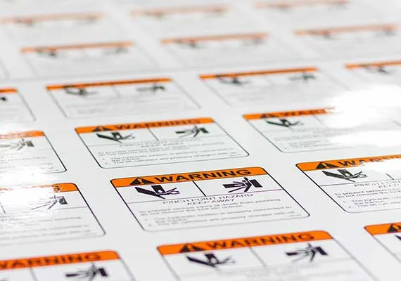 Printed OEM warning labels on a sheet