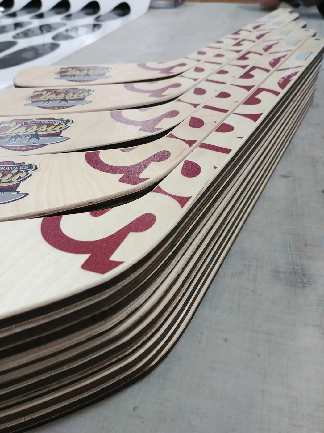 Stack of custom printed mini hockey sticks