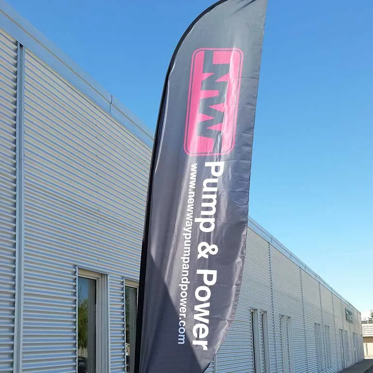 Printed feather flag outside a building